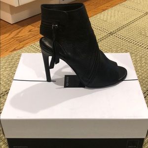 Dolce Vita black leather heel with zipper detail.